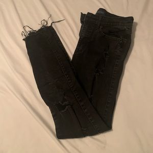 ripped highwaisted black jeans with frayed hems
